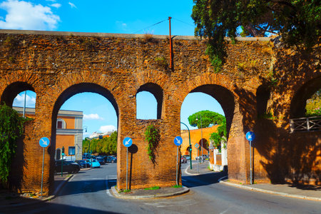 Porta Tiburtina ancient gate in the Aurelian Walls of Rome, Italy. Classic medieval brick archway on the street in Rome. Porta San Lorenzoの写真素材