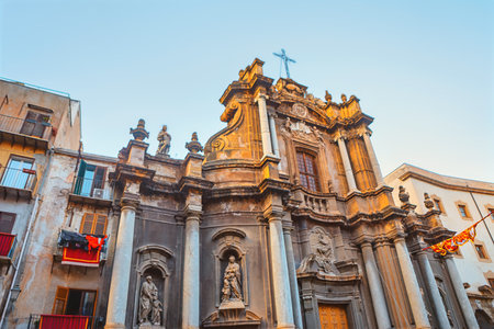 Church of Saint Anne the Mercy is a Baroque church of Palermo, Sicily. Ornate stonework adorns the church facade, contrasting with the surrounding buildings in Sicilyの写真素材