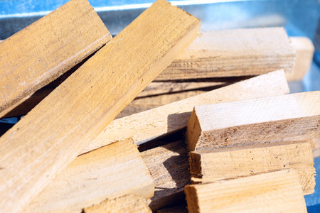 Stacked firewood, showcasing the natural grain and texture of the wood. Prepared firewood, neatly...