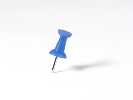 a blue map pin with elongated shadow on white backgroundの写真素材