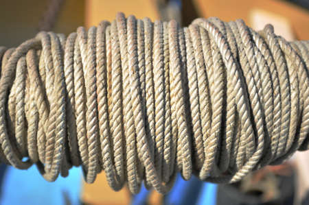 Close up of ships rope wound round a winch