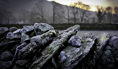 A close up of a dry stone wall in Cumbria Great Britain with mossの写真素材