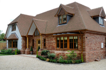 A modern detached brick built house with gravel drive and plantsのeditorial素材