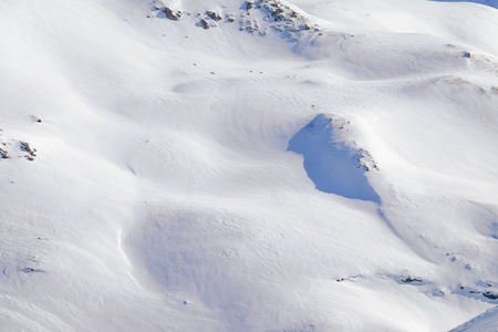 a snow covered slope of a mountain