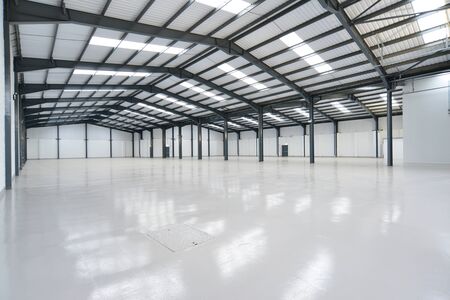 View of a large empty warehouse unitの写真素材