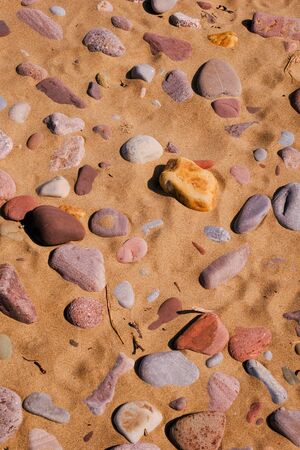 a section of beach sand and pebbles close upの写真素材