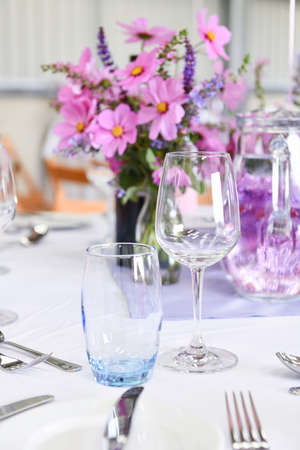 close up of table place setting at formal dinner with empty wine glassesの写真素材