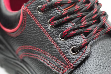 safety shoe black work boots isolate on white backgroundの写真素材