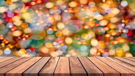 Abstract empty wooden floor with multicolored light. empty wood with bokeh light, for use as...