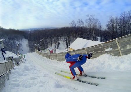 jump skier jumping against the blue skyの写真素材