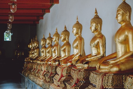 Row of Buddha statues at Wat Arun in Bangkok