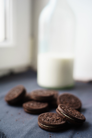 fresh cookies and milk on black fabricの写真素材
