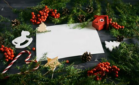 Blank card on a Christmas wooden background. White business card for designersの写真素材