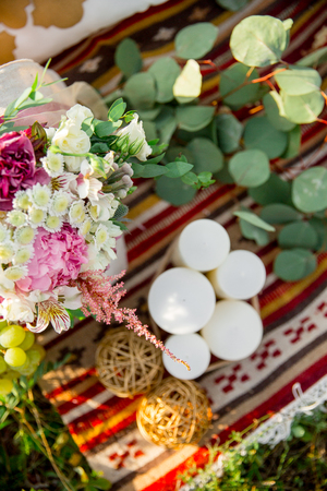 Flower decoration. Chamomile, eucalyptus, peonies, Alstroemeria, candleの写真素材