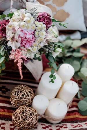 Close-up different flowers and candles. Flower decorationの写真素材