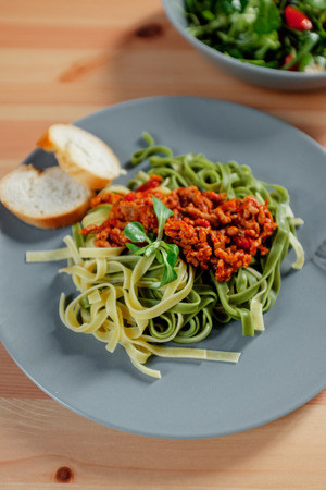 Spaghetti bolognese with beef tomato sauce on wood table , italian food. Fetuchini pastaの写真素材