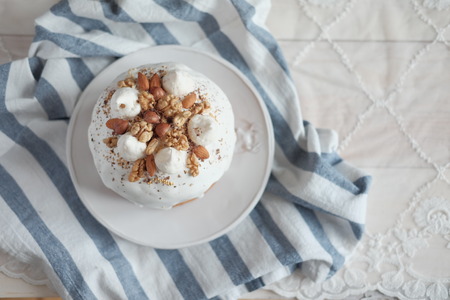 Easter cake with white icing on a plateの写真素材