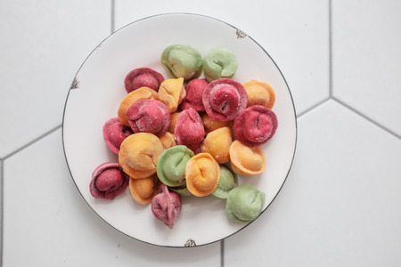 Multicolored dumplings stuffed with meatの写真素材