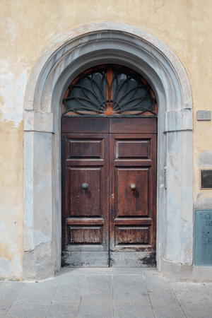 An ancient wooden door in Italy. Tour to Italyの写真素材