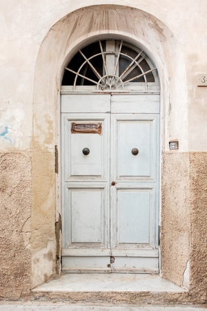 An ancient wooden door in Italy. Tour to Italyの写真素材
