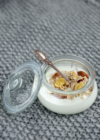 Natural yoghurt with muesli in a jarの写真素材