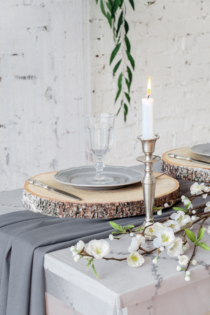 Decoration of wedding table in rustic style. Flowers on the tableの写真素材