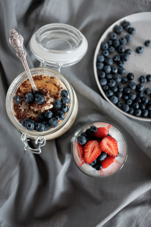 A healthy yogurt for breakfast with blueberries and strawberries.の写真素材
