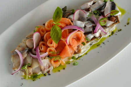 Fish mix with vegetables. Cold appetizer. White backgroundの写真素材