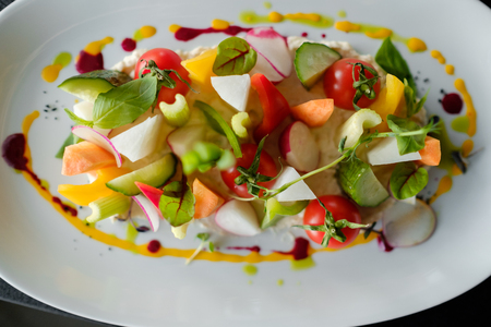 Vegetable plate. Beautiful serving of food in the restaurantの写真素材
