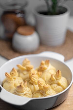 pastries from puff pastry with a filling in a baking dish. side view. close-up. cooking concept