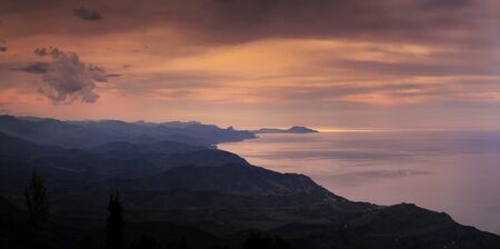 beautiful sunset on the coast. view from the mountain. sea view.