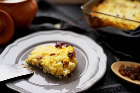 Close up view of cottage cheese casserole with raisins. home baking concept.