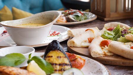 meal the hotel restaurant. Cream soup, salmon with grilled vegetables, shrimp salad, pizza with...