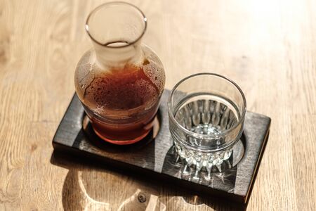on the table is a jar of alternative coffee and a glass. Hario v60. concept filter Coffee. top view