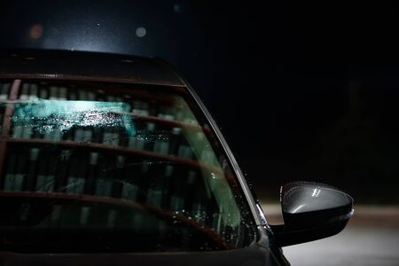 Car windshield close up. Cleaning Car Using High Pressure Water. Car close-up. Car washの写真素材