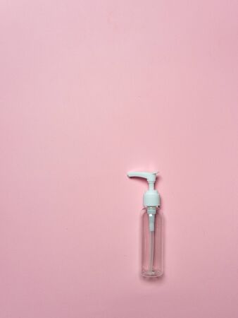 Plastic dispenser for cosmetics isolated on a pink background. Beauty. Ecology. Beauty products.の写真素材