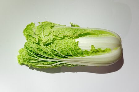 fresh chinese cabbage on a white butt farm vegetables. The concept of veggie. vitaminsの写真素材