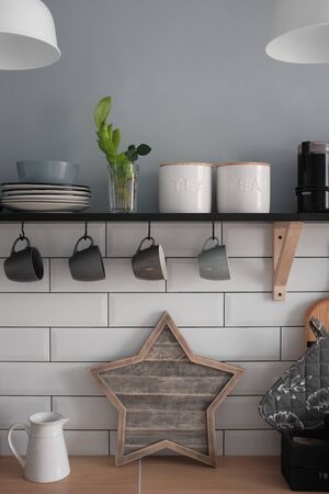 Beautiful modern interior design in the kitchen in the Scandinavian style. White grey kitchen room...