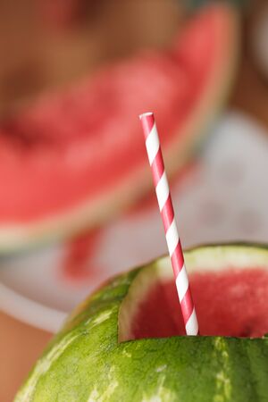 watermelon with a straw. Watermelon with alcohol. Drunk watermelonの写真素材