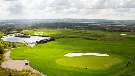 Russian open space. field, forest, sky, road. Summer landscape. golf course top viewの写真素材
