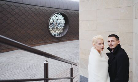 Bride and groom close-up. Newlyweds look at each other in love. Happy bride and groom after wedding...