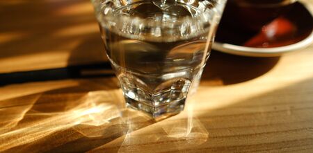 Stylish served specialty alternative black coffee. Filter pour-over coffee served in crystal glass and decanter. Aesthetics coffee. Manual brewing still life. Morning coffee in the cafeの写真素材