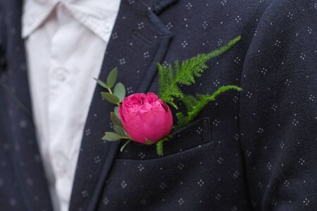 Grooms boutonniere on the wedding day, wedding details. Beautiful luxury wedding blog concept....