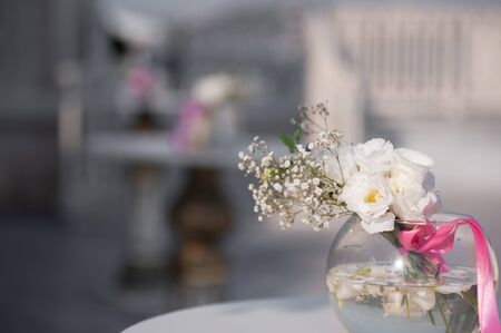 Wedding day. beautiful Wedding tables with sunny day. Beautiful wedding flower decorations. Wedding Set upの写真素材