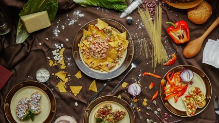Mexican food, many dishes of the cuisine of Mexico, flat lay, shot from above on a black background. Nachos, tequila, guacamole etcの写真素材