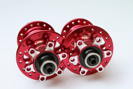 a brand new pair of red hubs for mountain bikes.の写真素材