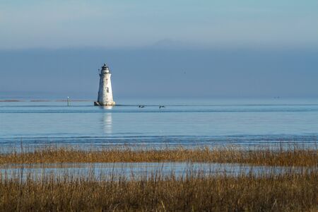 Cockspur lighthouse near Fort Pulaskiの写真素材