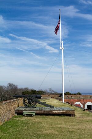 Cannon and Flag at Fort Pulaski next to Tybee islandのeditorial素材