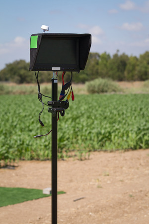 Outdoor monitor with light shield installed on a stand in use for drone control and video streamingの写真素材
