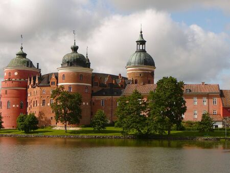 Castle overlooks waterの写真素材